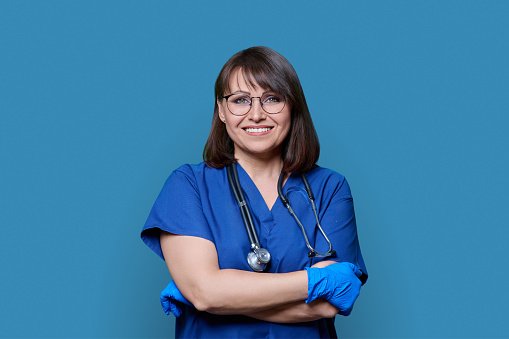 A clinician with arms crossed