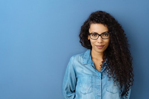 A doctor in glasses and denim