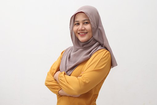 A doctor wearing a hijab, confident smile