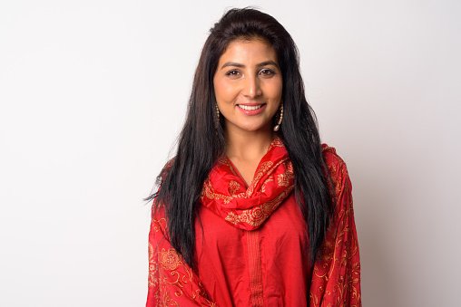 A doctor in a red outfit, smiling